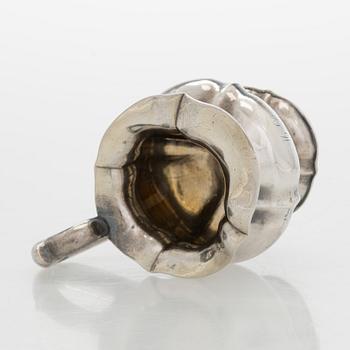 A silver cream jug, maker's mark of Michael Takkinen, St. Petersburg 1856.