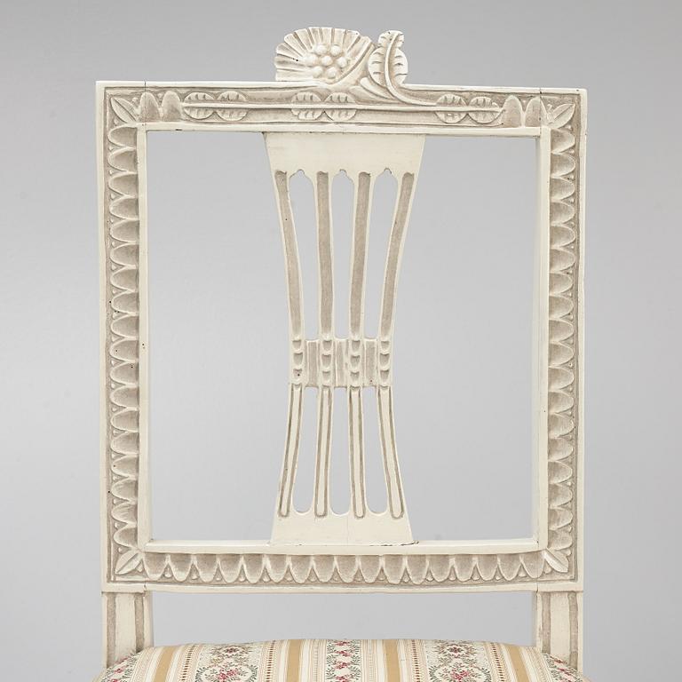 A sofa, three chairs and a table, Gustaivan style and of the Gustavian period, 19th-20th century.