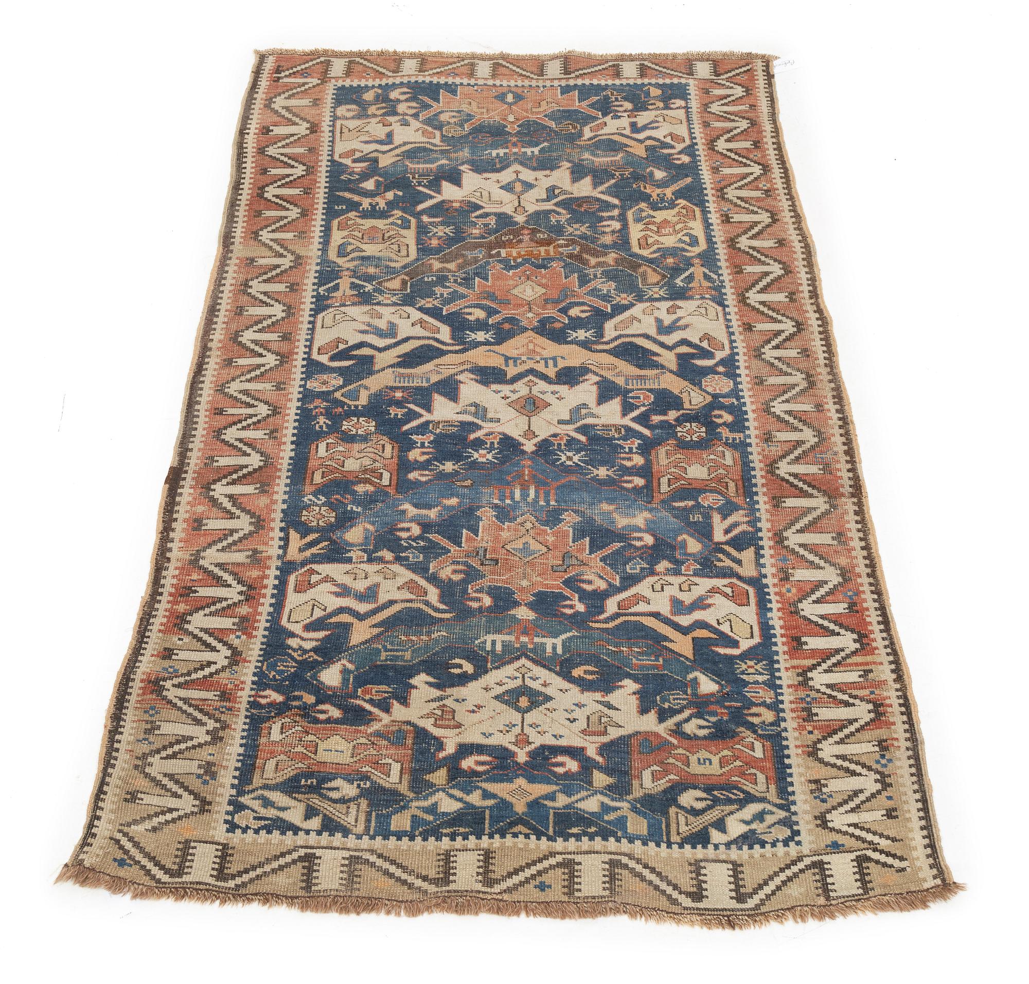An oriental rug, c. 200 x 115 cm.