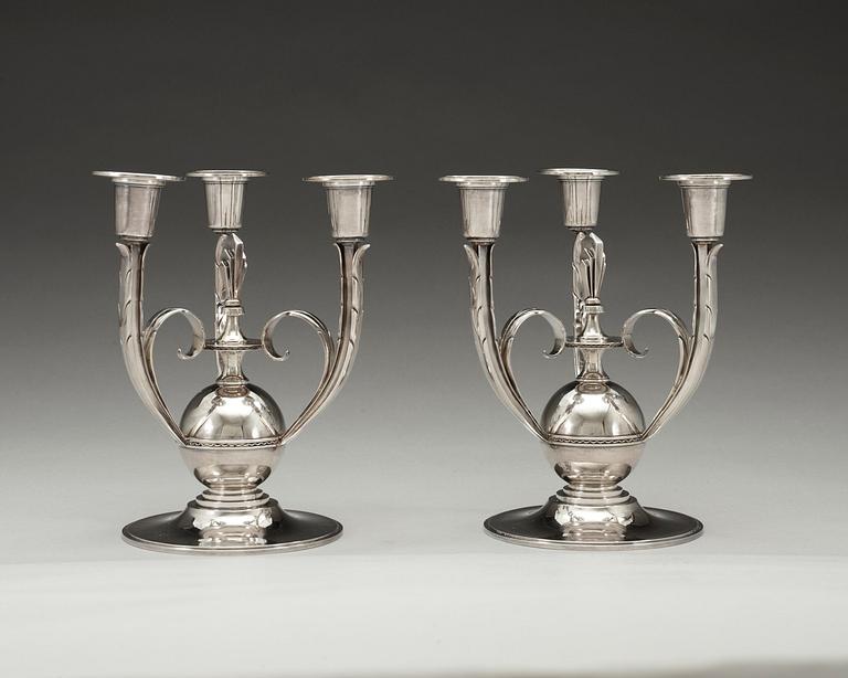 A pair of Atelier Borgila silver candelabra for three candles, Stockholm 1932.