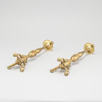 A pair of brass candlesticks, made around year 1900.
