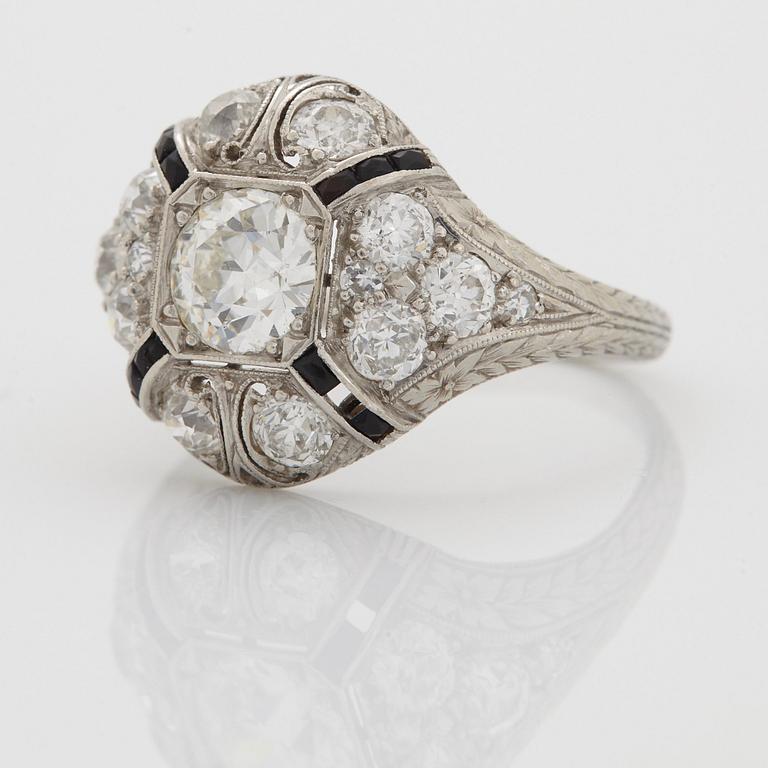 A platinum ring set with an old-cut diamond.