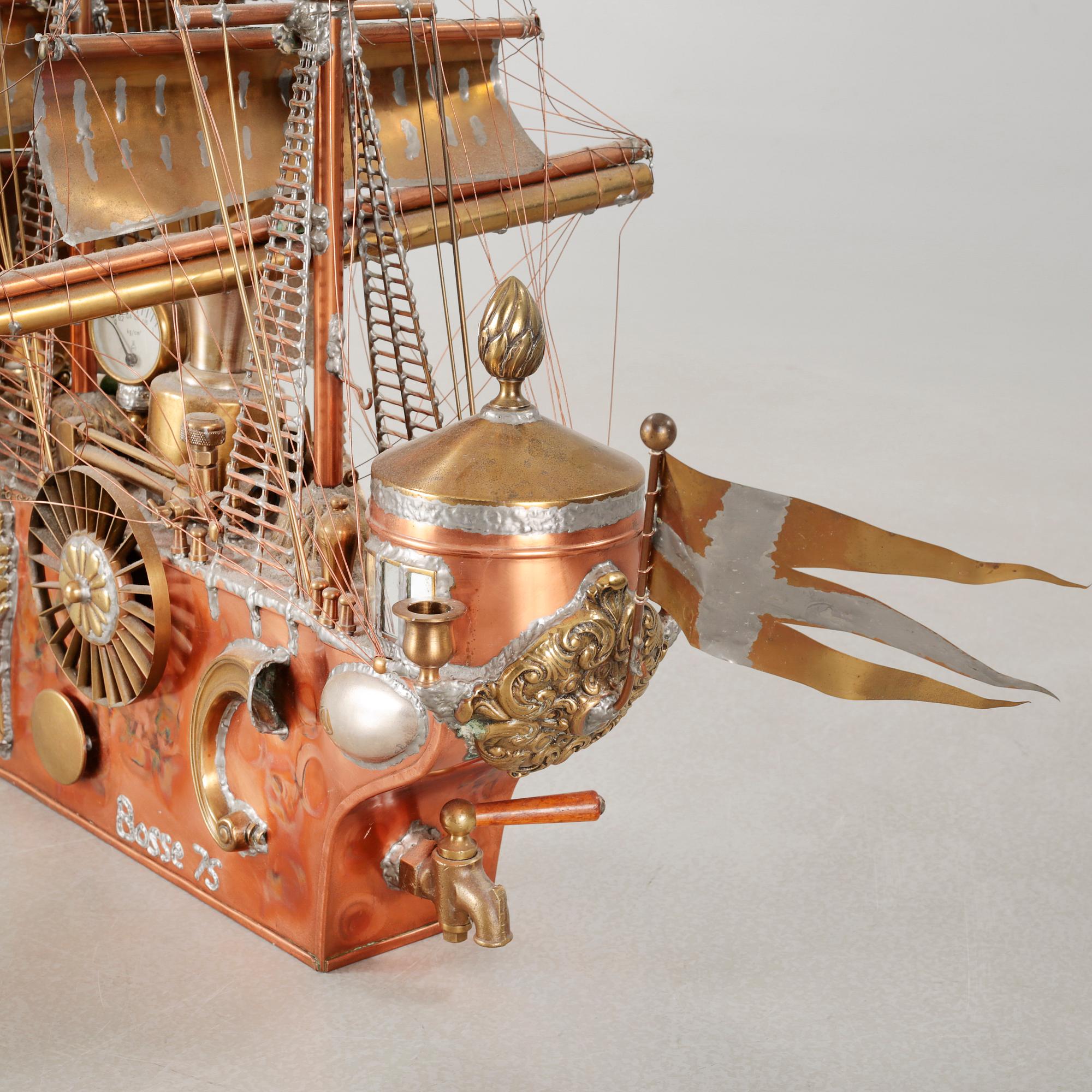 A boat sculpture, dated -75.