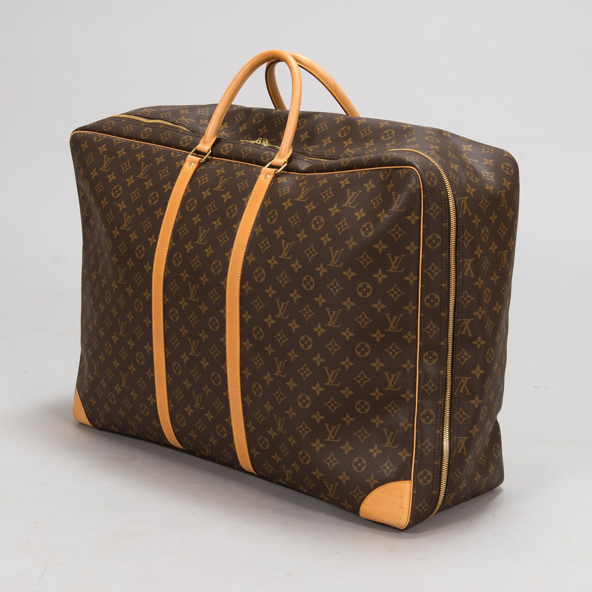Louis Vuitton, A Monogram Canvas Sirius 70 Suitcase. - Bukowskis