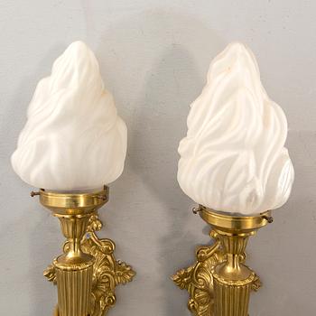 A pair of wall lamps later part of the 20th century.
