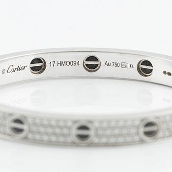 An 18K white gold Cartier bracelet "Love" with round brilliant-cut diamonds and ceramic.