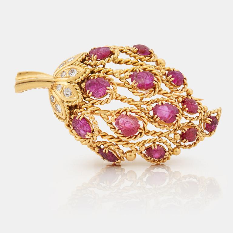 A 1950/60's brooch by Cartier, in the shape of a strawberry, set with carved rubies and brilliant cut diamonds.