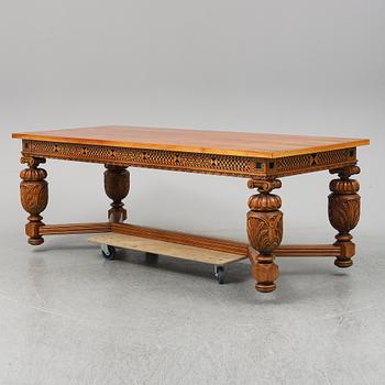 A 20th century baroque-style mahogany table.