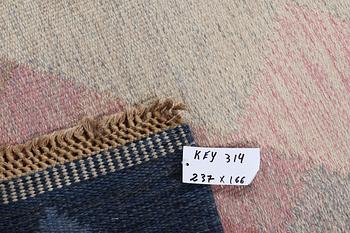 A flat weave carpet, signed S, ca 237 x 166 cm.