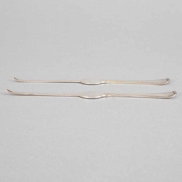 A set of ten French 19th century silver lobster-cutery.