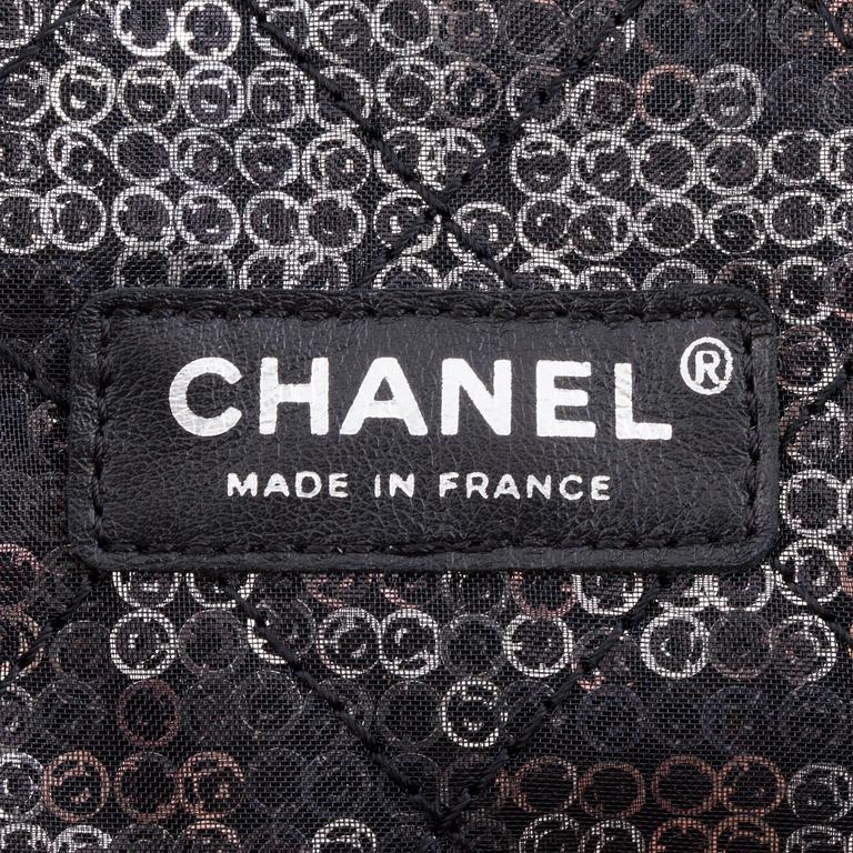 CHANEL, a black and silver tinsel evening "Flap-bag".
