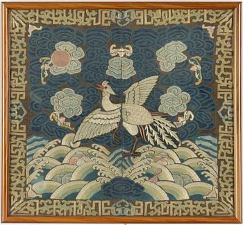 An embroidered civil official's rank badge with a bird, 'buzi', Qing dynasty.