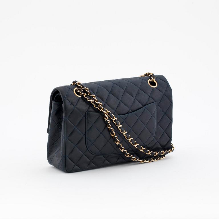 CHANEL, a quilted blue leather "Double Flap" shoulder bag.