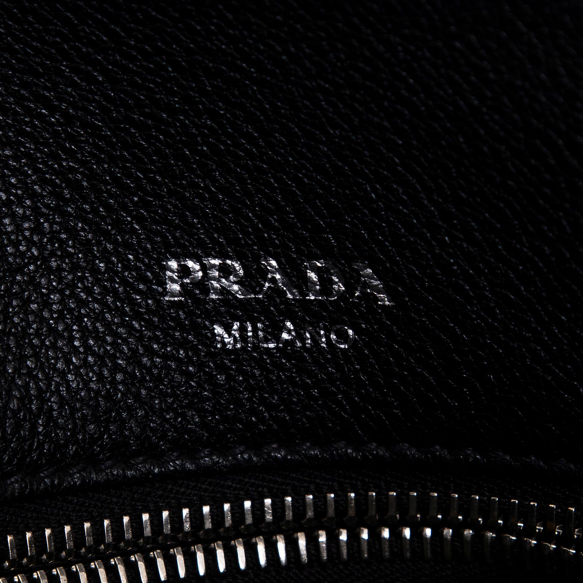 Prada, a leather bag.