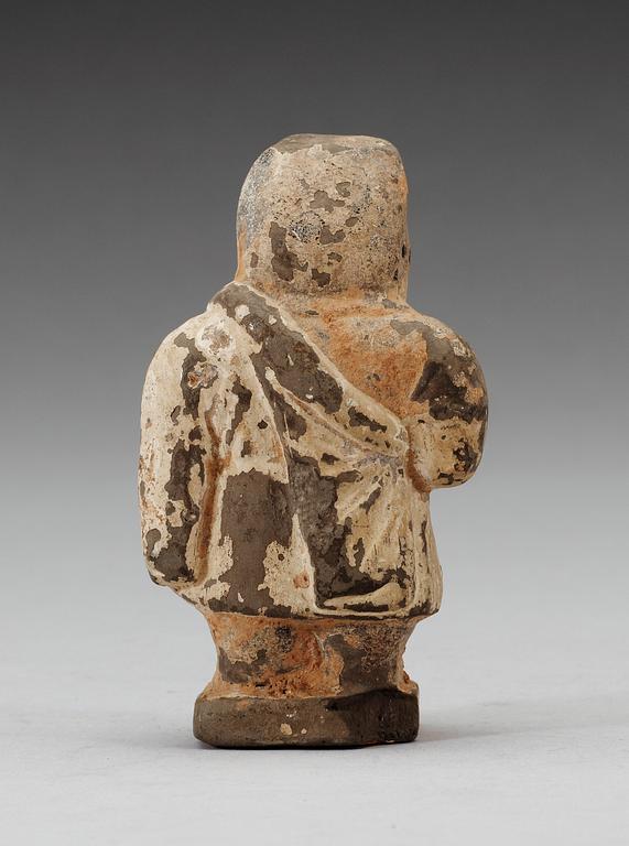 A small potted figure of a man, Han dynasty (206 BC - 220 AD).