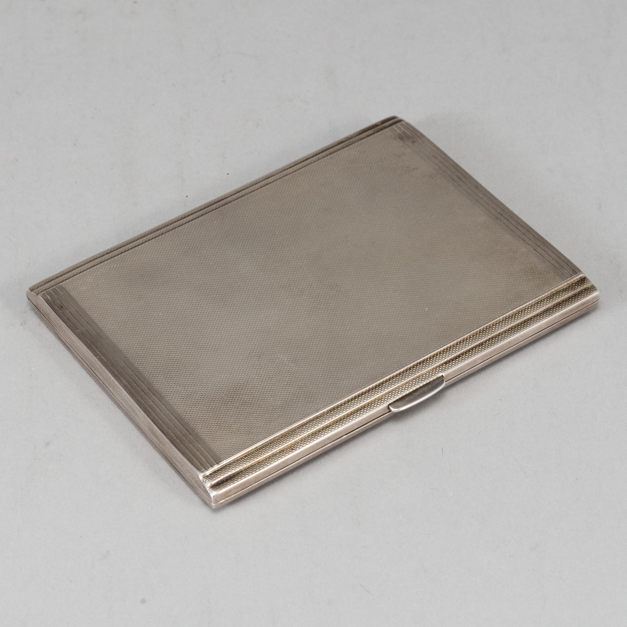 A sterling silver cigarette-case, made in 1935 by Dingley (or Davies) Brothers, Birmingham, England.