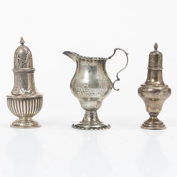 Two silver casters and cream jug, England.