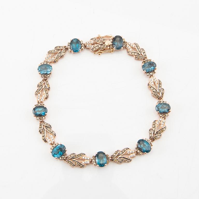 Armband 14K roséguld med runda briljantslipade diamanter och ovalt fasetterade topaser, LeVian.