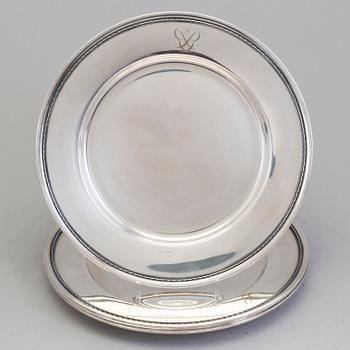 Four monogrammed Swedish silver charger plates, Makers's mark GAB, Stockholm, 1949.