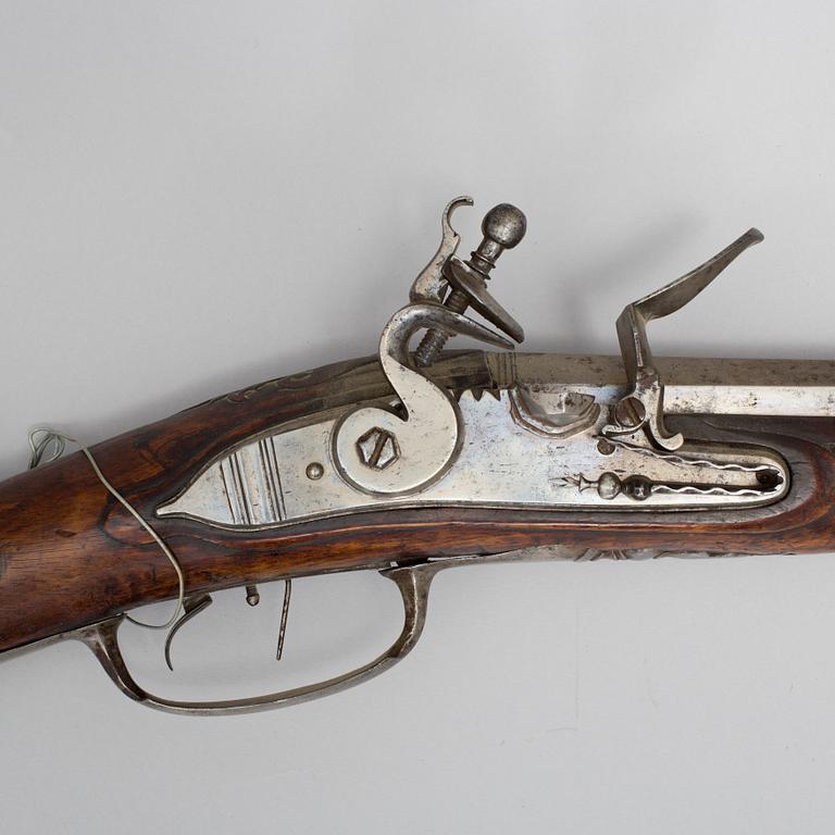 A 18th century flintlock rifle.