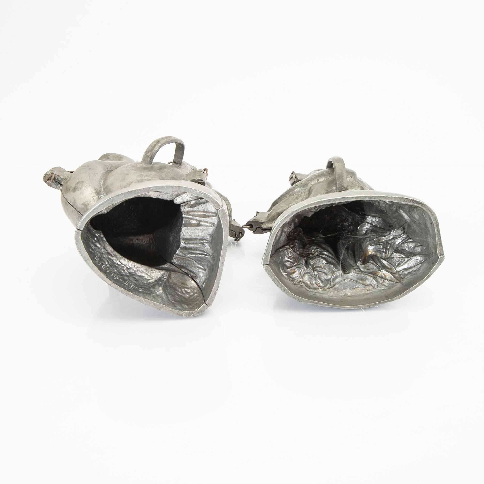 A set of four pewter icecream moulds around 1900.