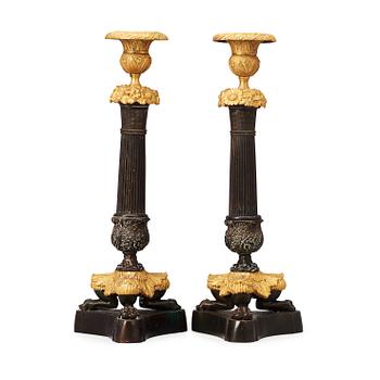 1466. A pair of late Empire 19th century candlesticks.