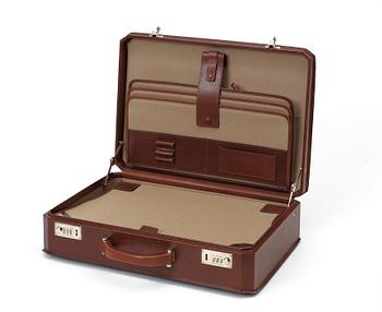 A brown embossed leather briefcase by Salvatore Ferragamo.