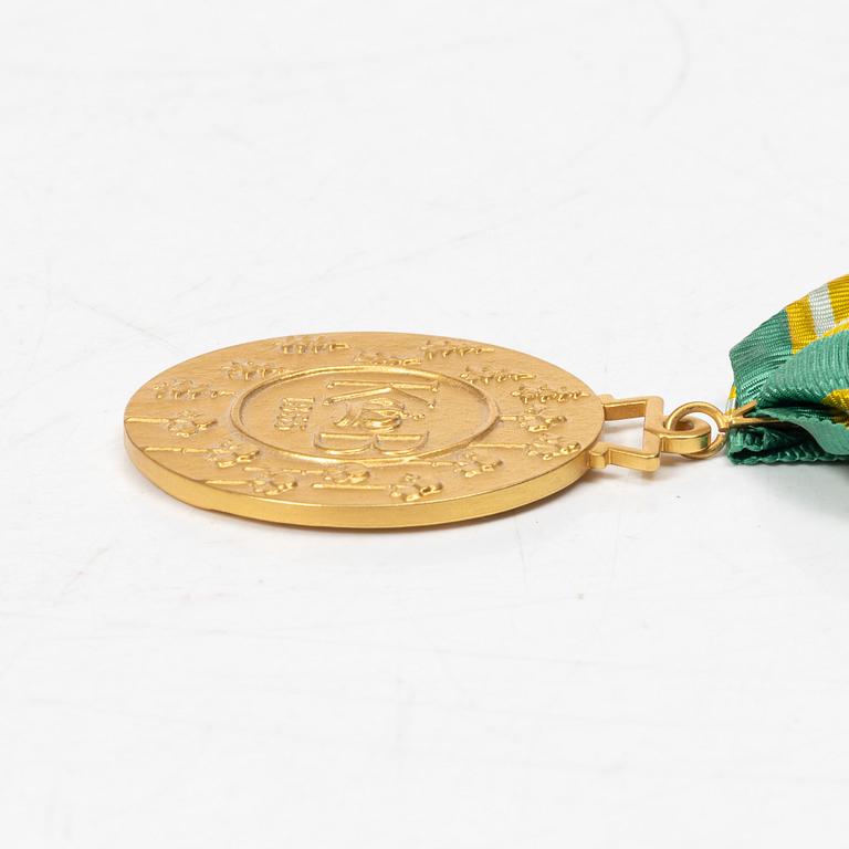 An 18K gold medal, Sporrong, Stockholm 1958.