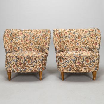 A pair of mid-20th-century armchairs.