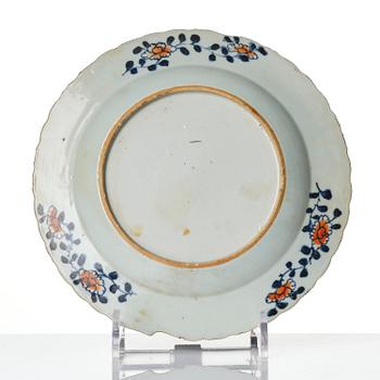 A set of three famille rose 'tobacco leaf' plates, Qing dynasty, Qianlong (1736-95).