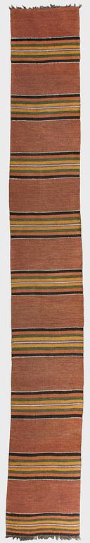 A 1930/1940s rag rug /runner. Circa 550 x 74 cm.
