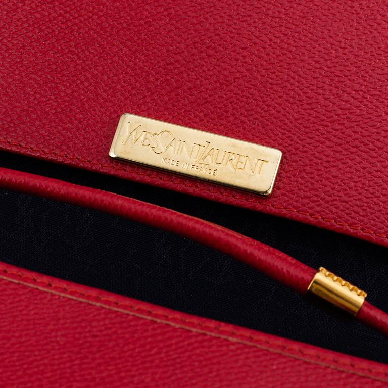 YVES SAINT LAURENT, a red leather bag.