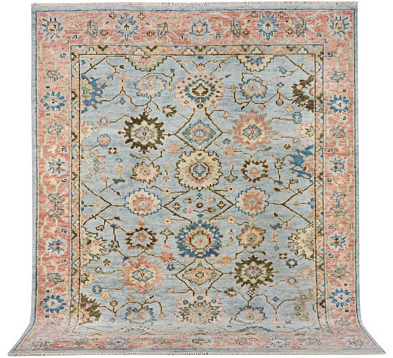 An oriental carpet with Mamluk design, c. 302 x 252 cm.