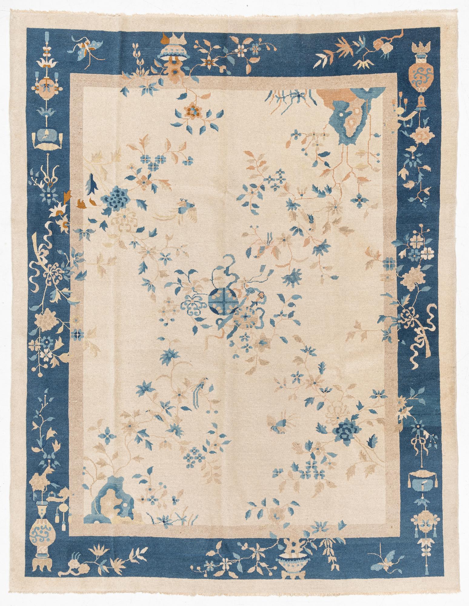 A semi-antique China/Nepal carpet, c, 385 x 297 cm.