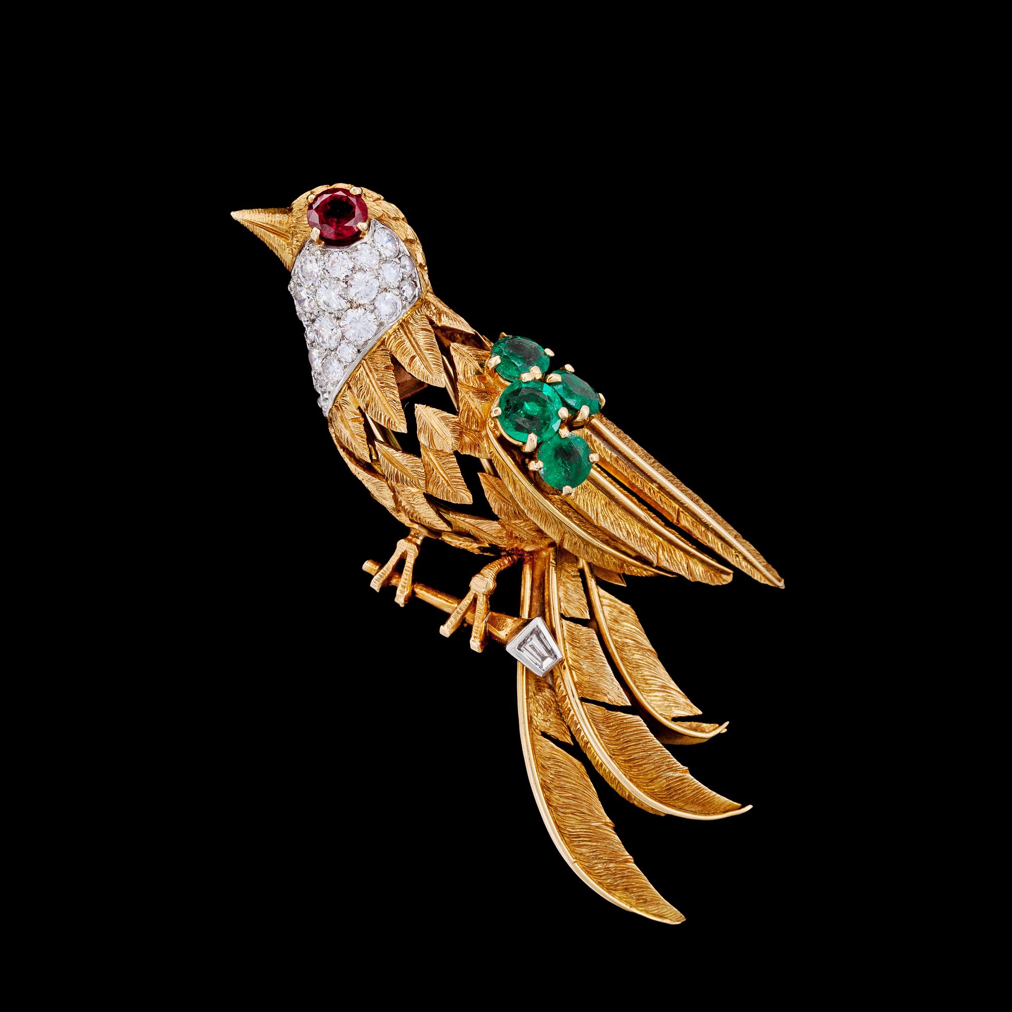 BROSCH, Cartier, briljantslipade diamanter, tot. ca 0.70 ct, rubin och 4 smaragder, ca 1950-tal.