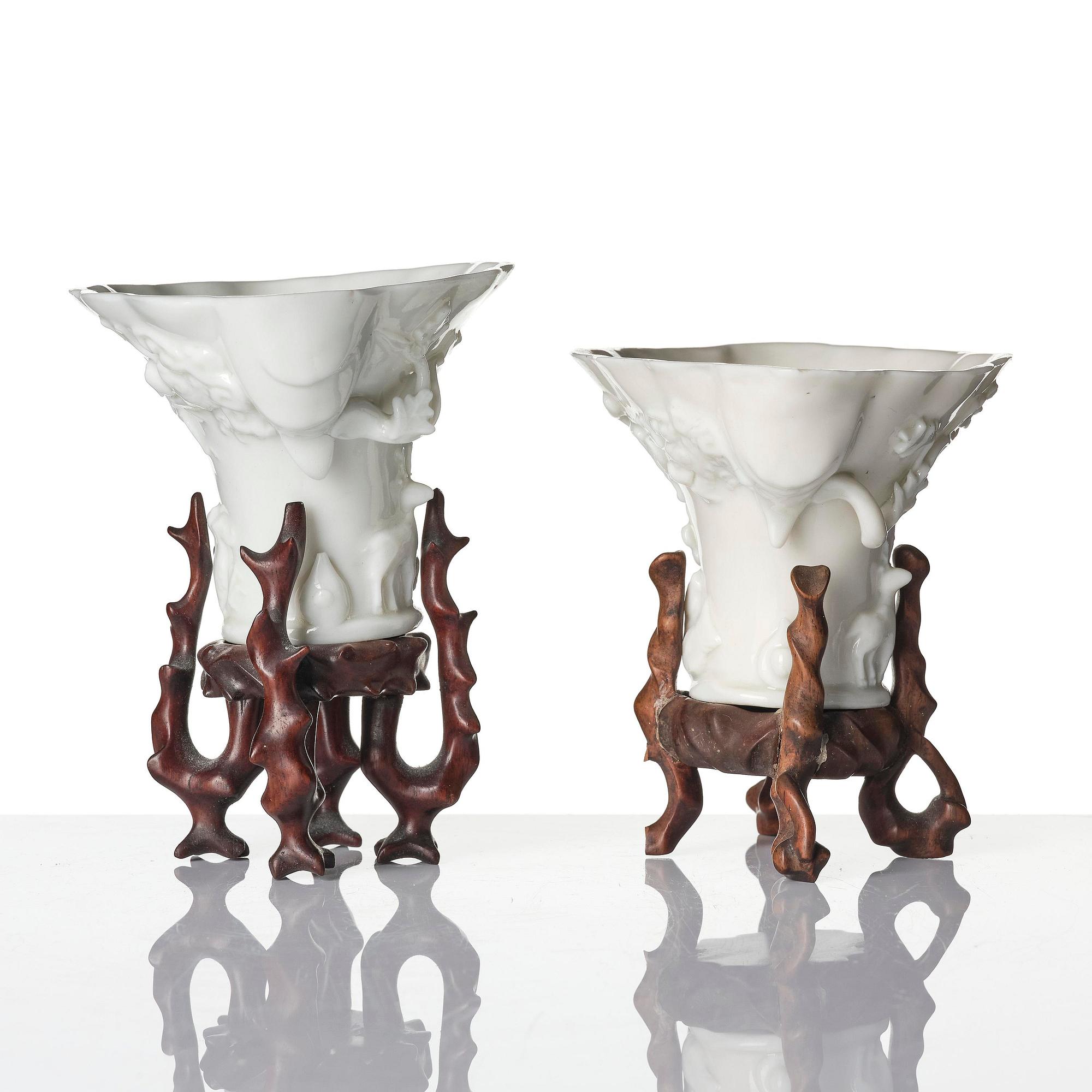 A pair of blanc de chine rhinoceros libation cups, Qing dynasty, Kangxi (1662-1722).