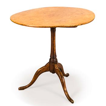 11. A tilt top table, first half of 19th Century.