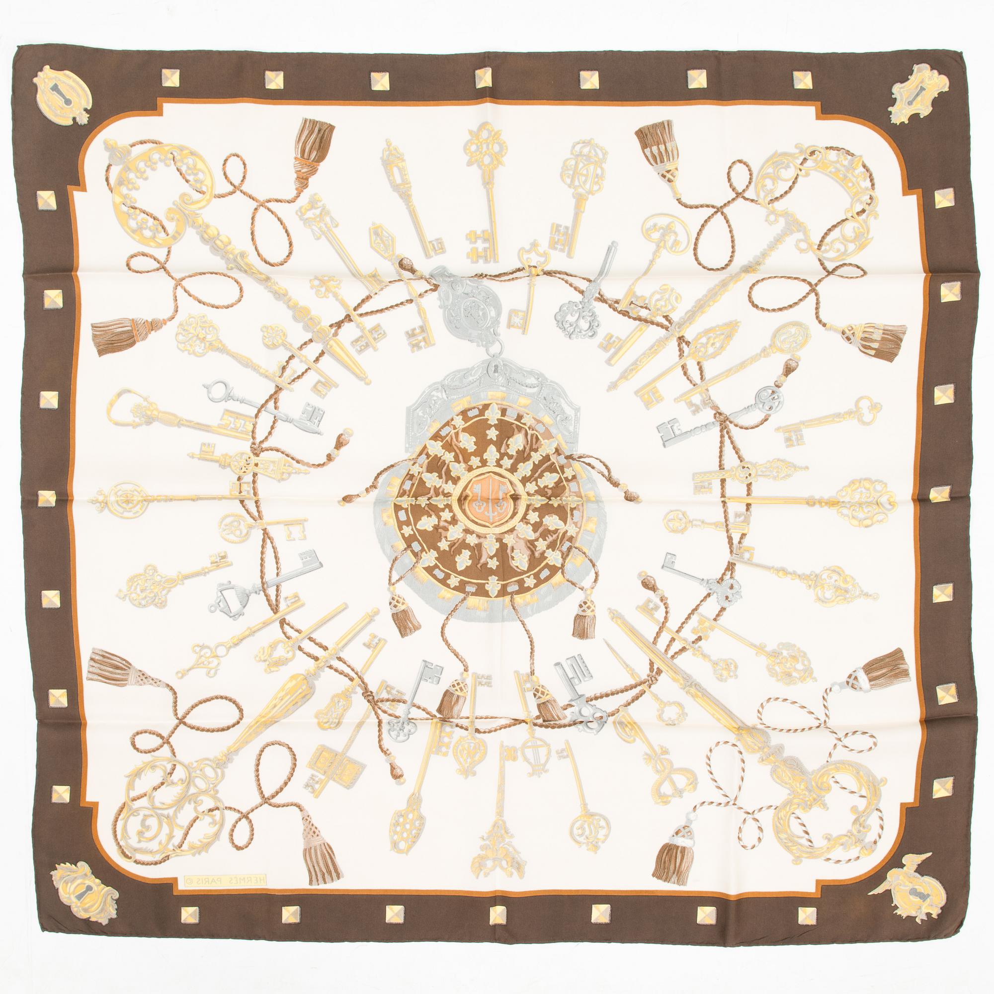 Hermès, Two silk scarves, 'Les Voitures a Transformation' and 'Les Clefs'.