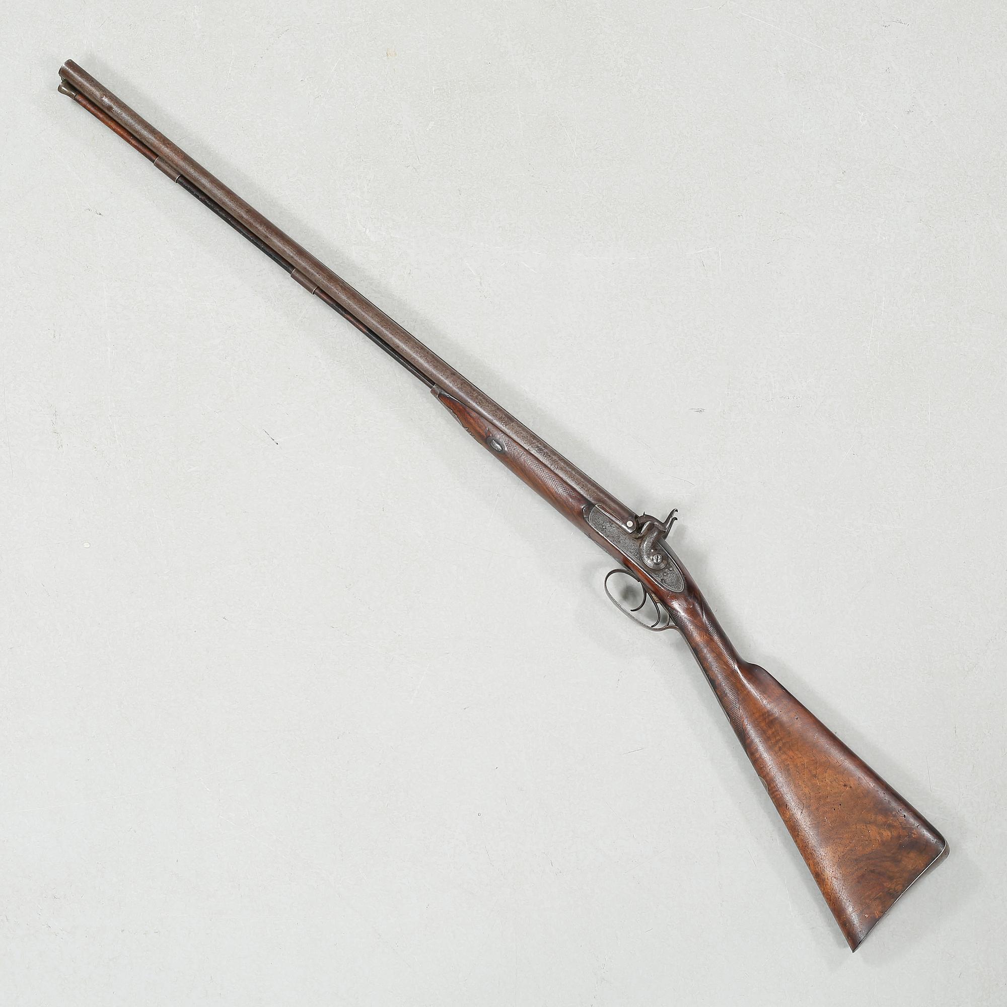 A percussion rifle by Charles William Lanchester in London, around the mid 19th century.