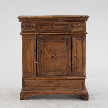 A Baroque style cabinet, circa 1900 with older parts.