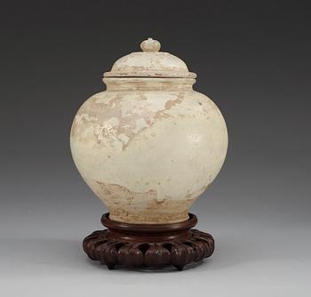 A cream glazed potted jar, Tang dynasty (618-907 AD.).