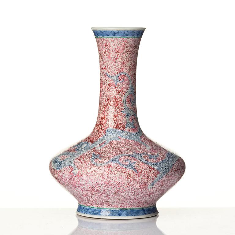 A rare pink and blue enamelled vase with dragons, late Qing dynasty/Republic with an apocryphal Qianlong mark.