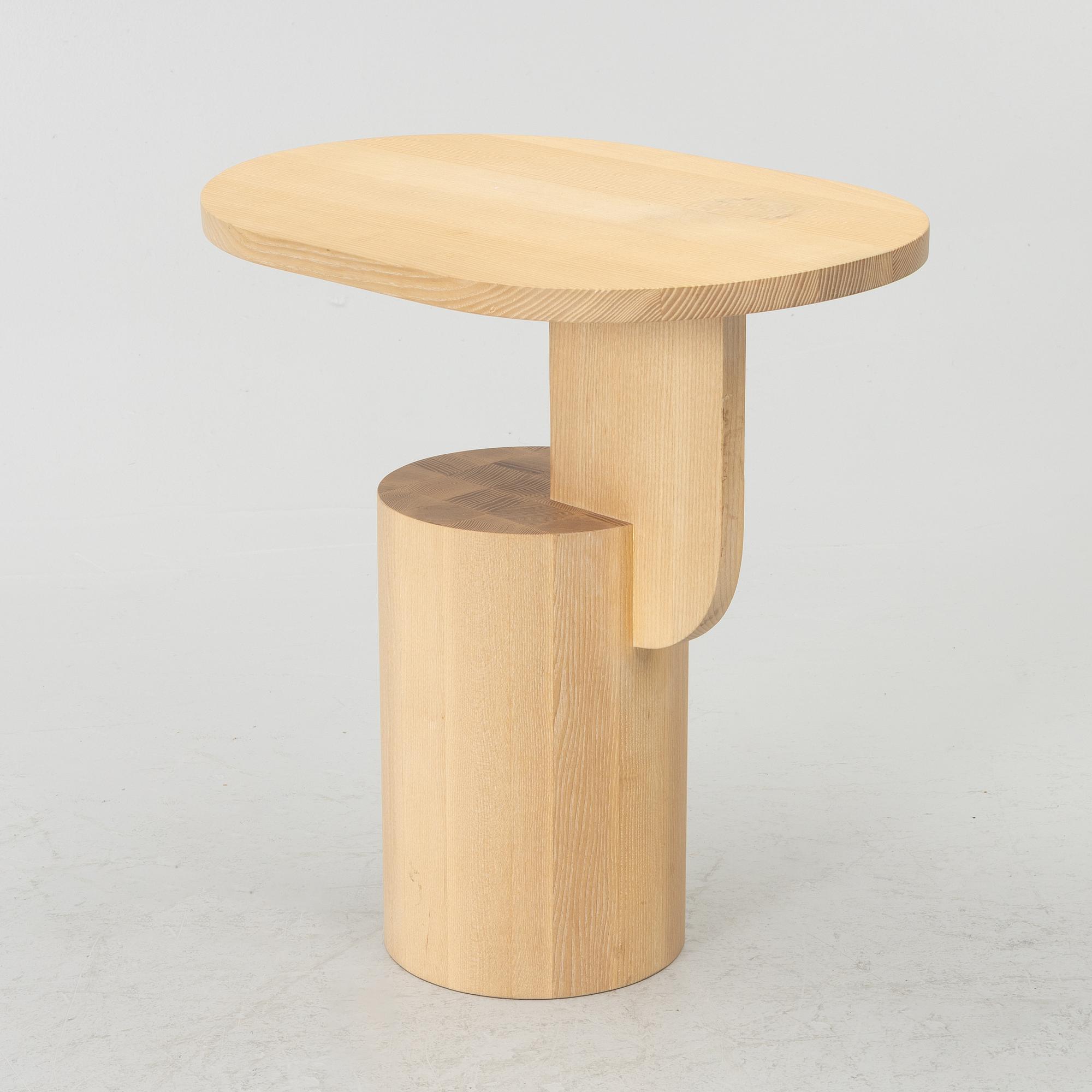 An 'Insert' side table, Firm Living.