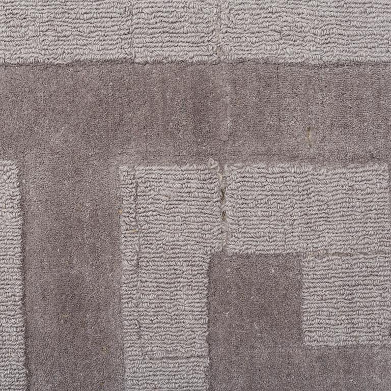 A Layered "Wool Cubes" carpet, 390x620 cm.