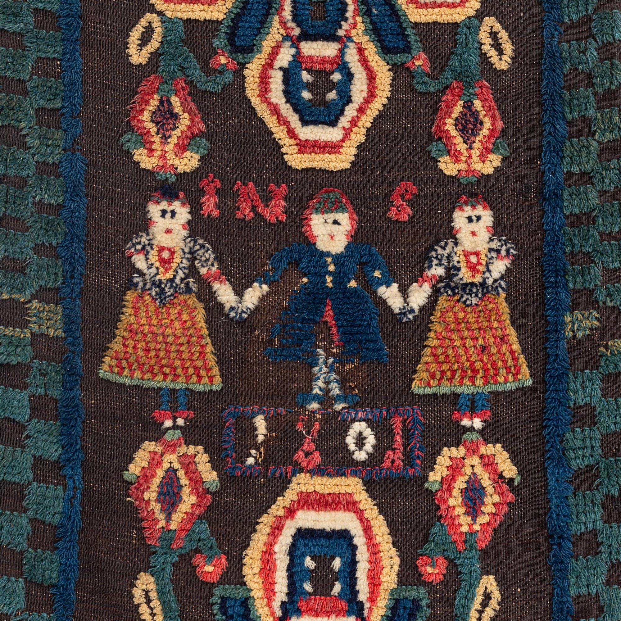 A carrige cushion, knotted pile in relief, c. 104 x 48 cm, probably Skytts district dated 1801.