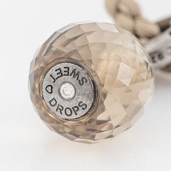 Ole Lynggaard,  "Sweet drop" pendant silver with smoky quartz, with textile band.