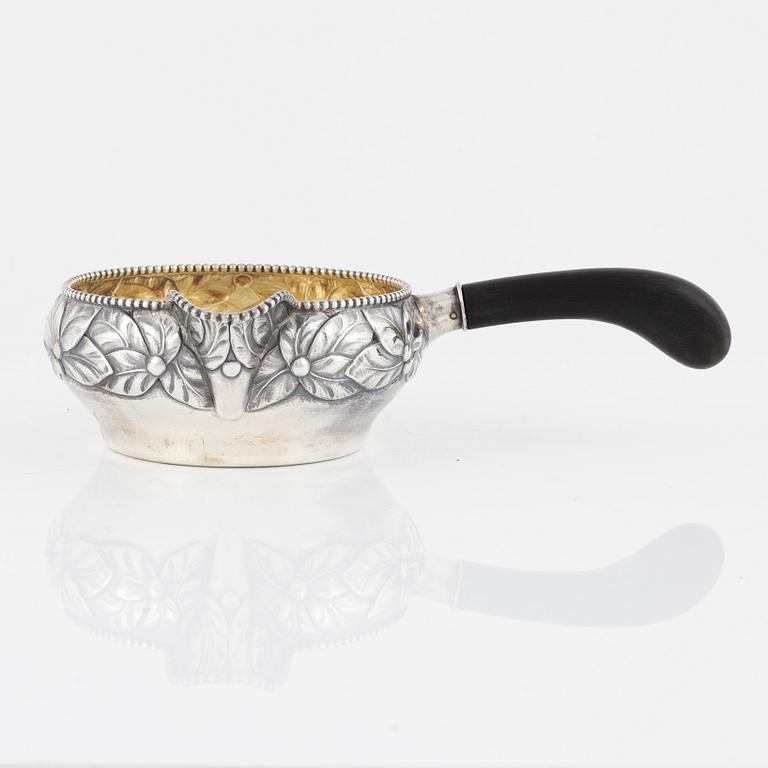 A parcel.gilt sauce dish with handle, Denmark, 1919.