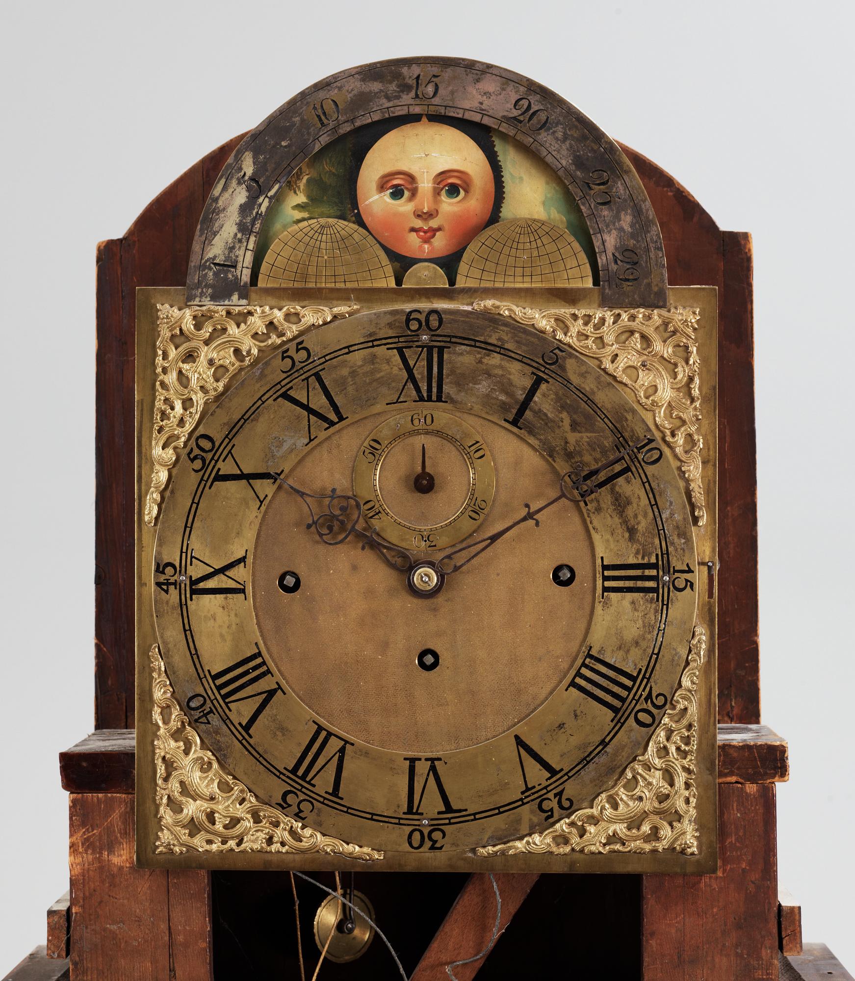 An English circa 1800 mahogany veneer longcase clock.