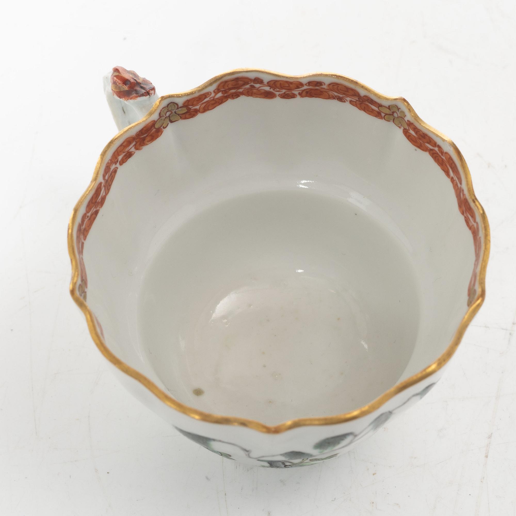 A pair of Chinese famille rose teacups with saucers and a pair of plates and two dishes, Qing dynasty, 18th century.
