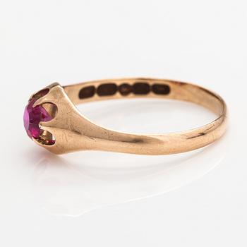 A 14K gold ring with a synthetic ruby.